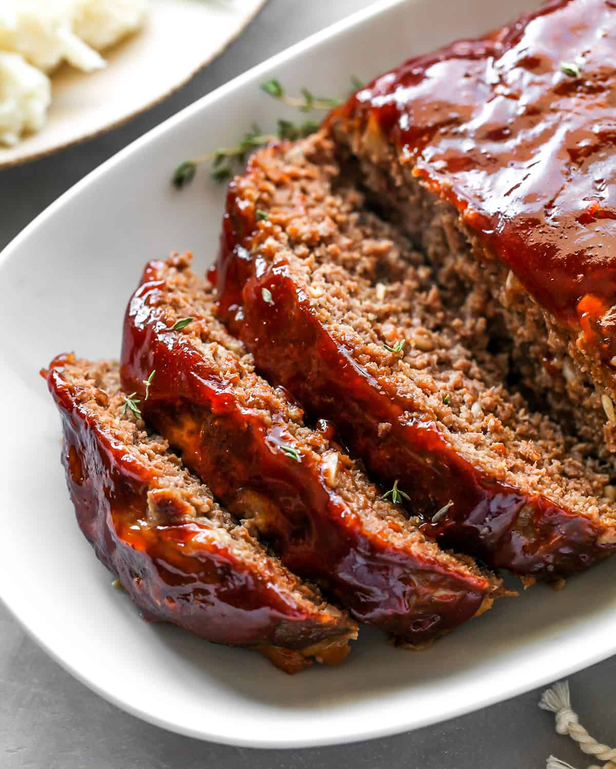 front view of slices of the Best Meatloaf Recipe on a platter