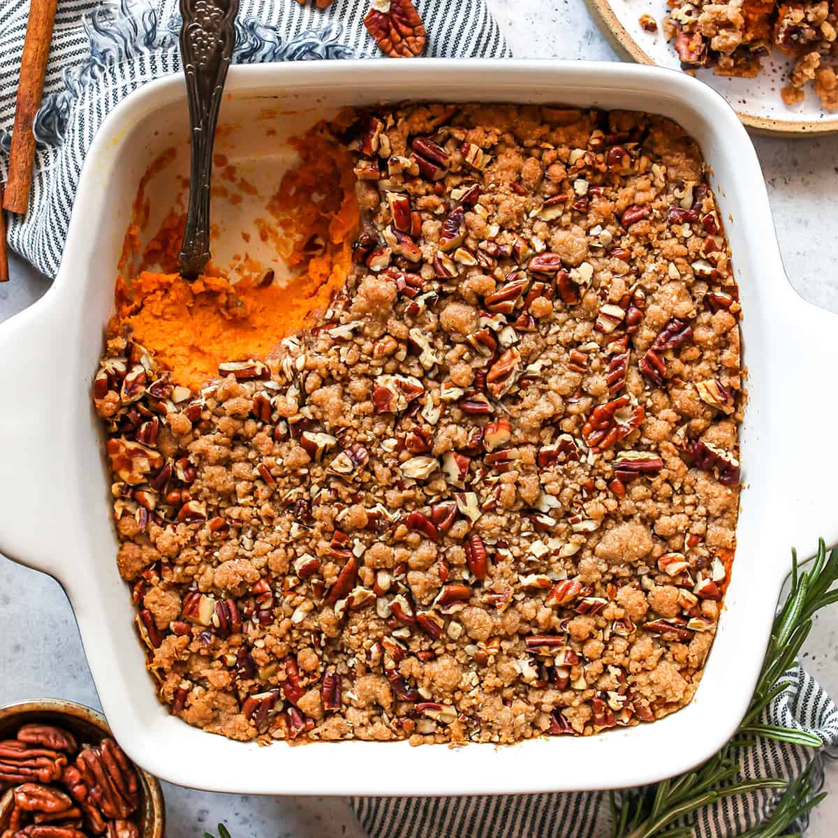 Best Sweet Potato Casserole Recipe in a baking dish with a serving spoon