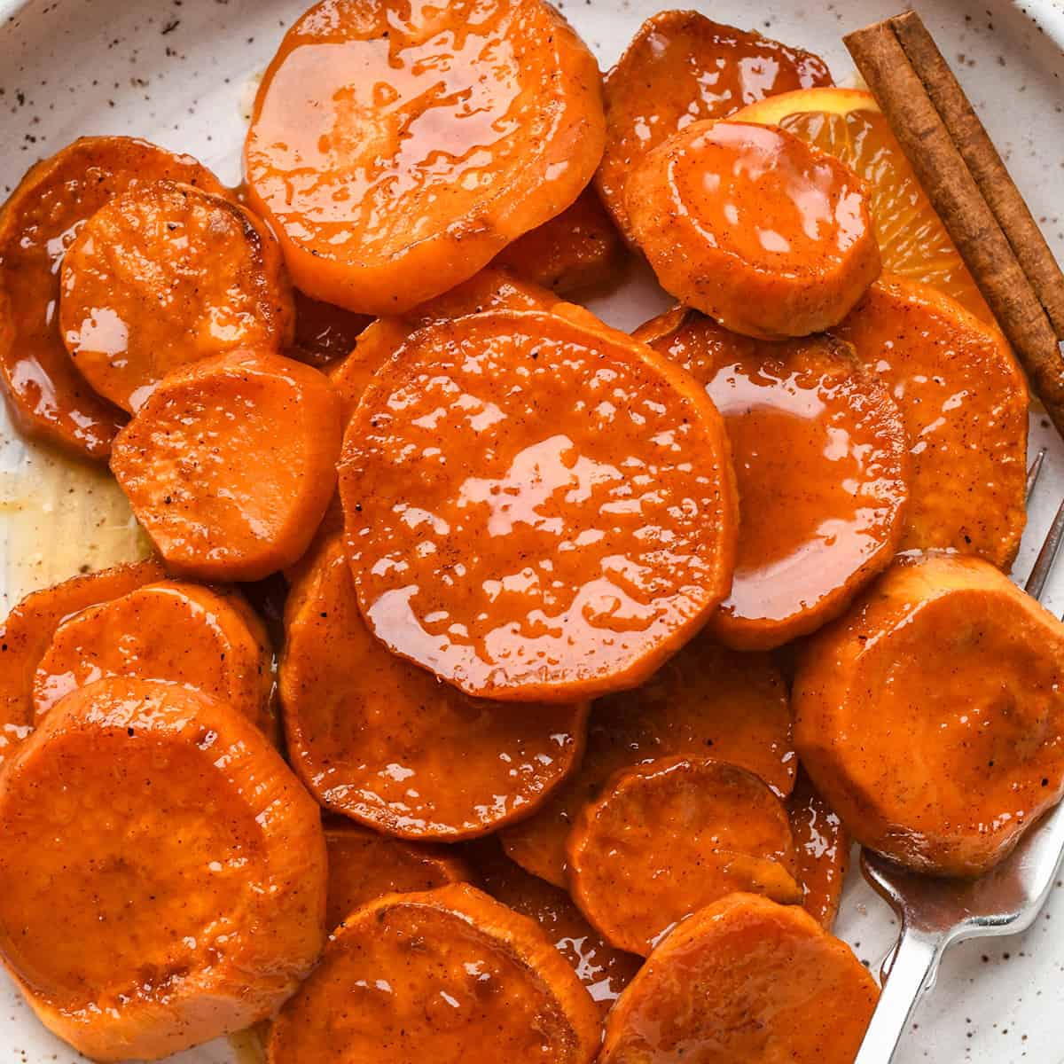 Candied Yams on a plate with a fork
