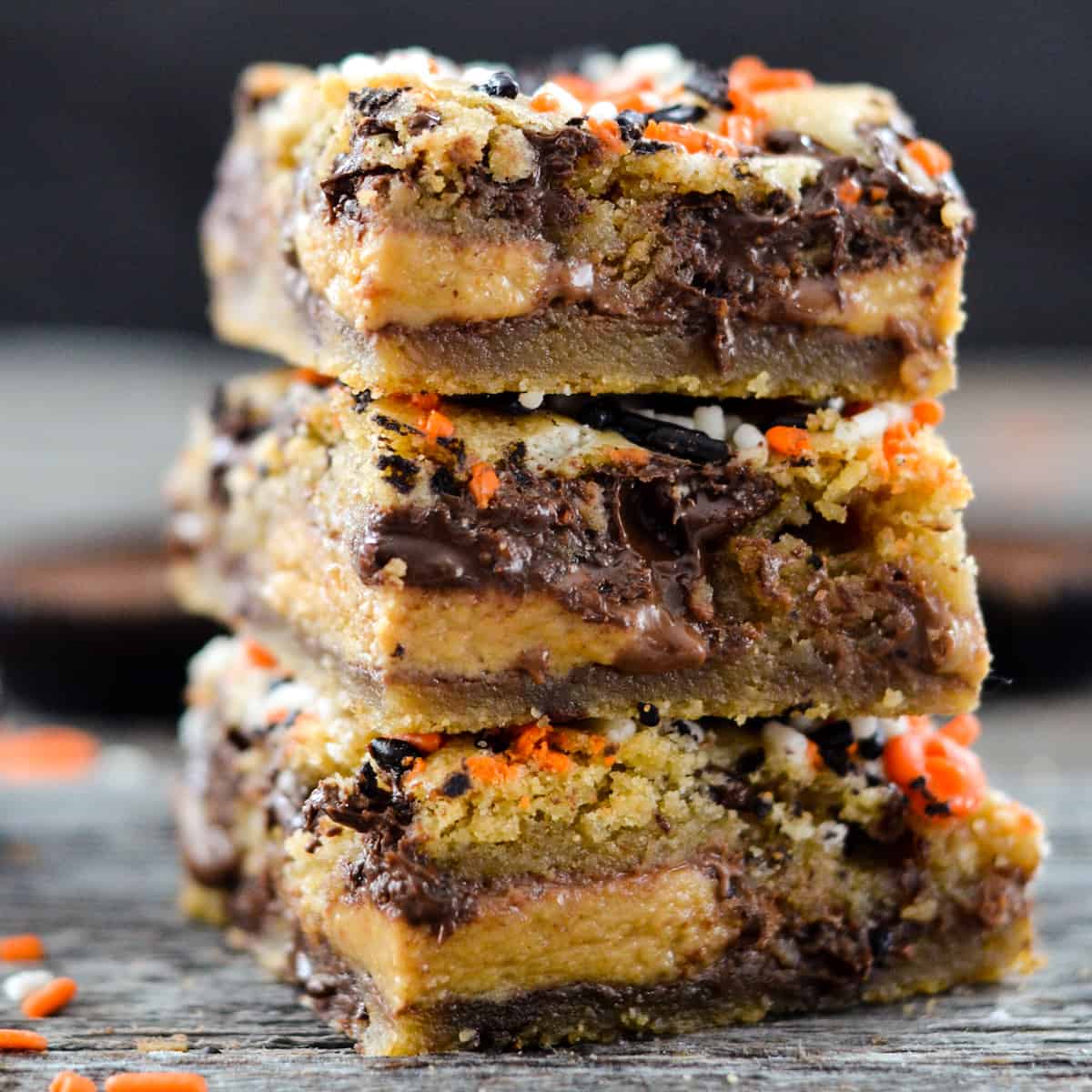 front view of a stack of three halloween cookie bars.