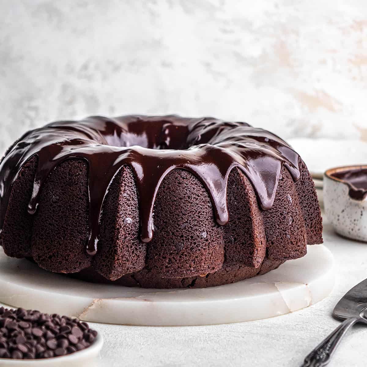 Chocolate Bundt Cake with chocolate glaze on a cake plate