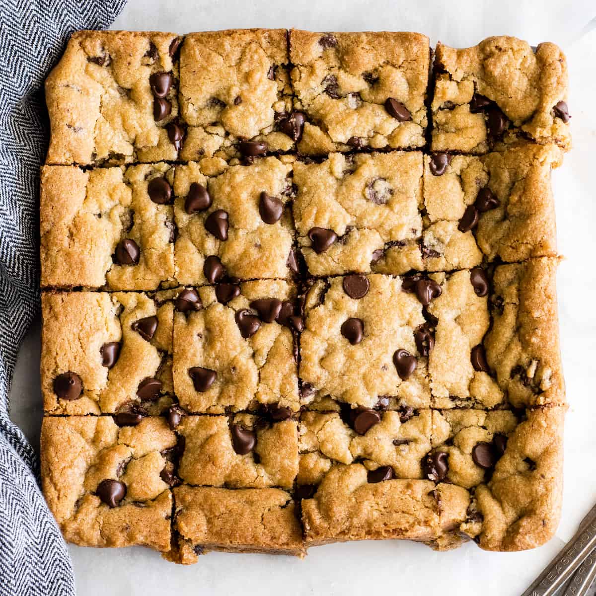overhead view of 16 chocolate chip cookie bars cut into squares