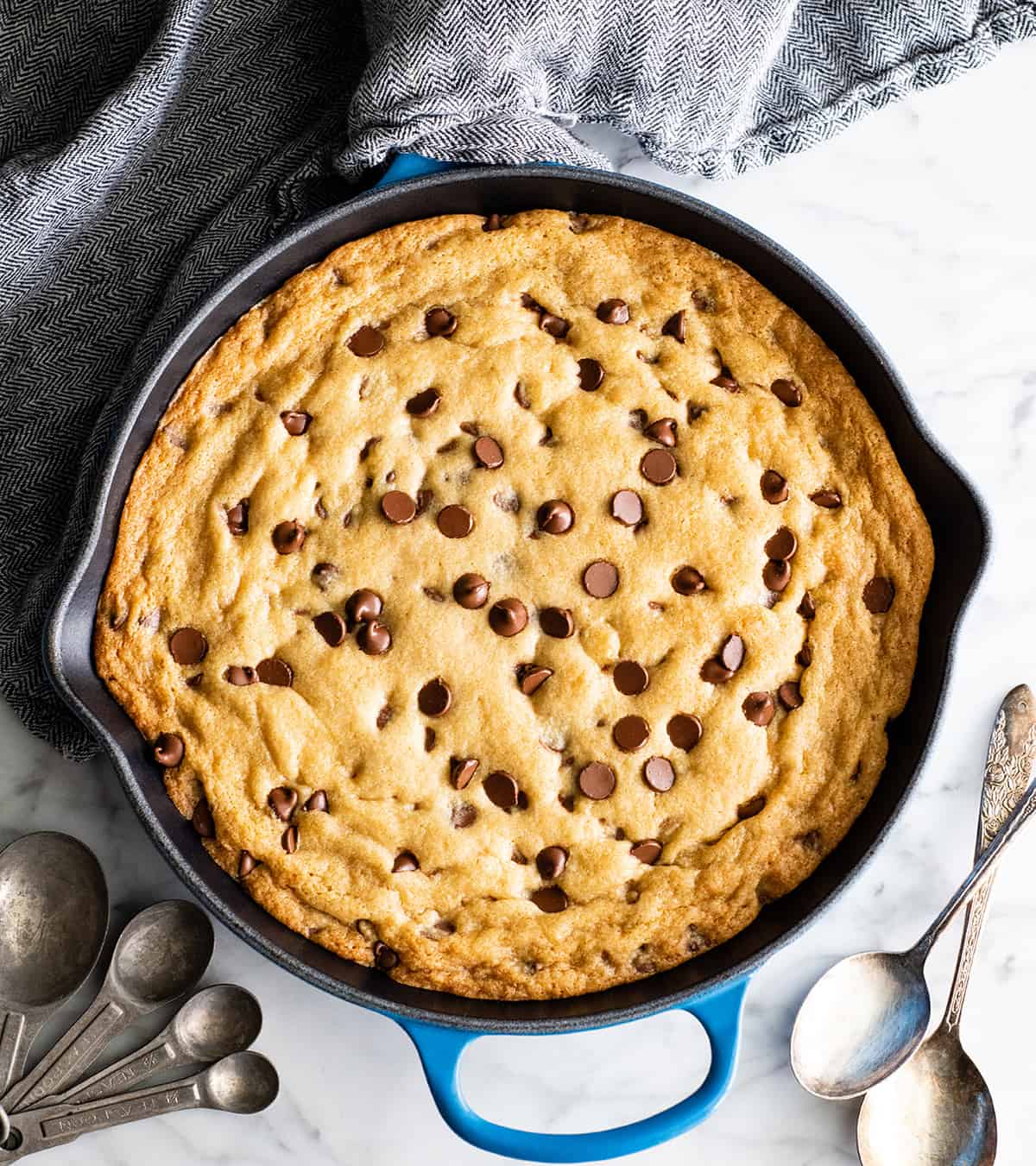 overhead view of a baked chocolate chip skillet cookie