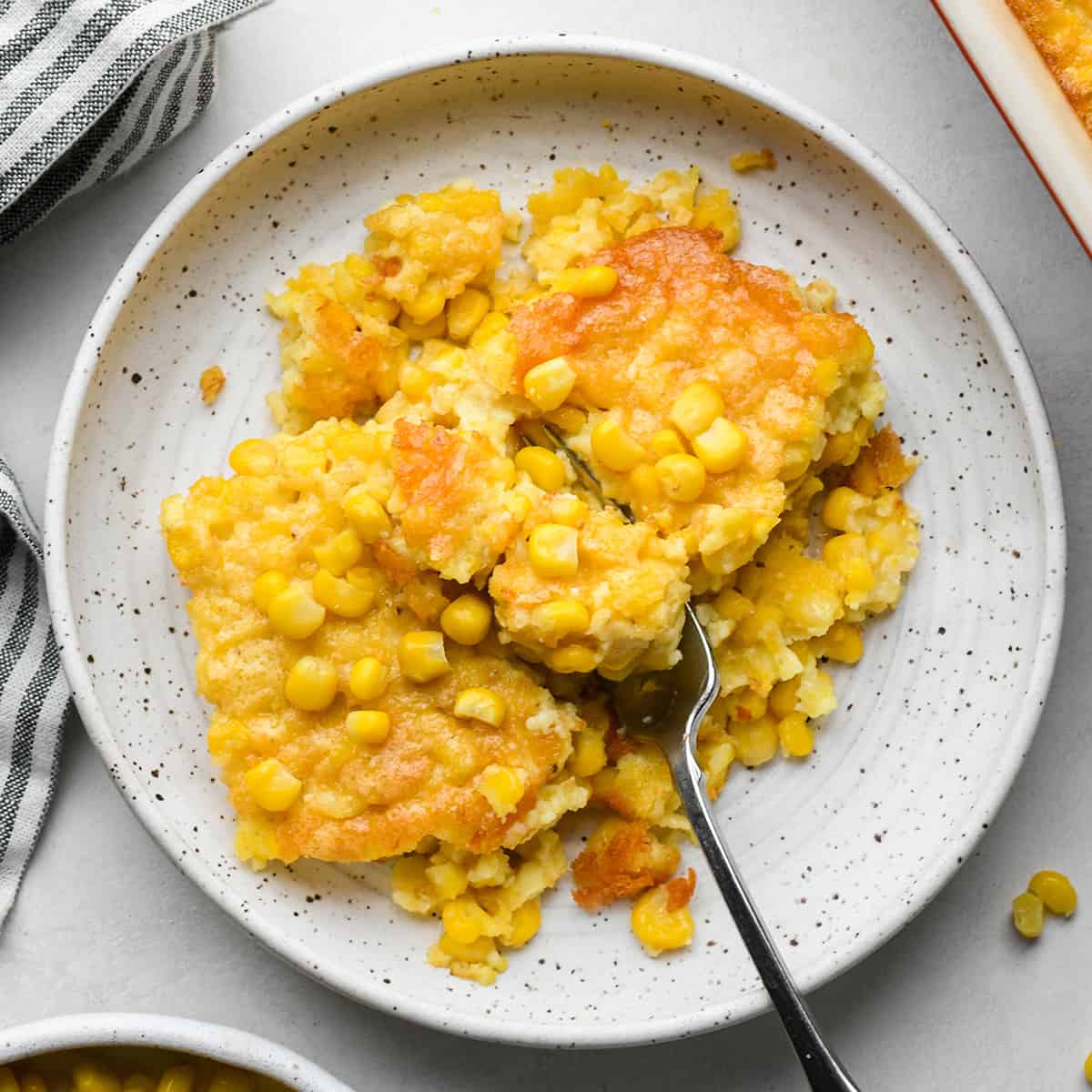 Corn Pudding on a plate with a fork
