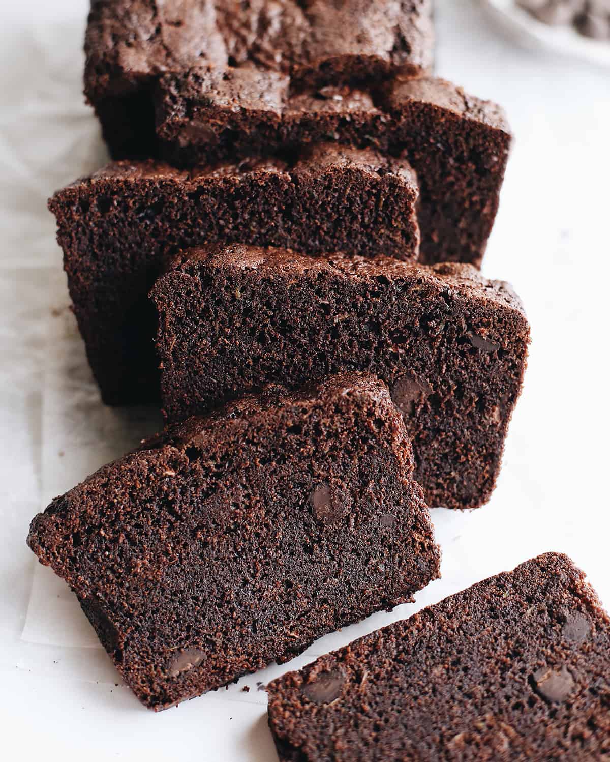 overhead photo of Double Chocolate Zucchini Bread with 5 slices cut out of it