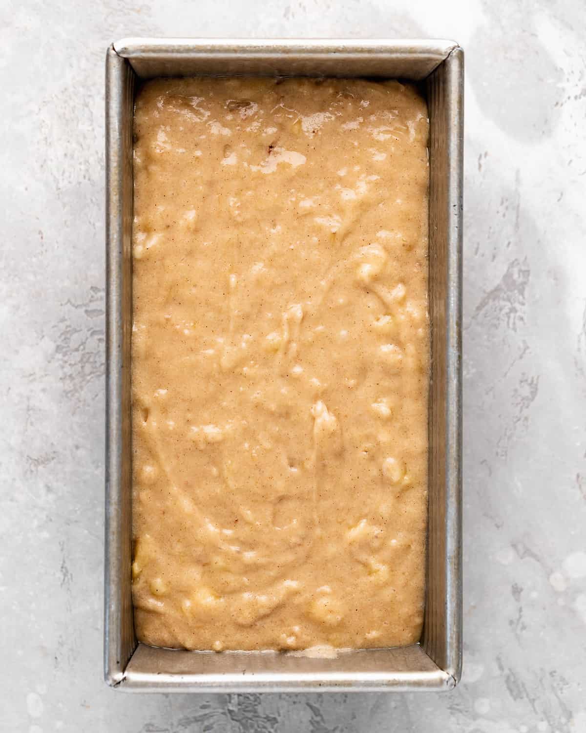 banana bread batter in a loaf pan before baking