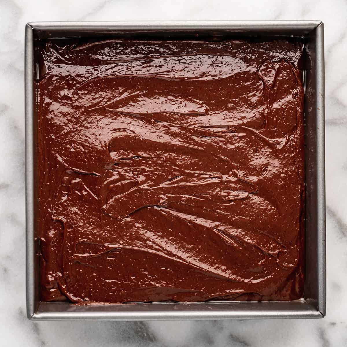brownie batter in a pan before baking