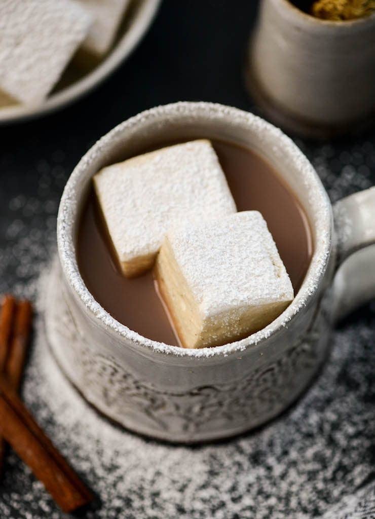 Overhead view of two Homemade Marshmallows in a mug of hot chocolate