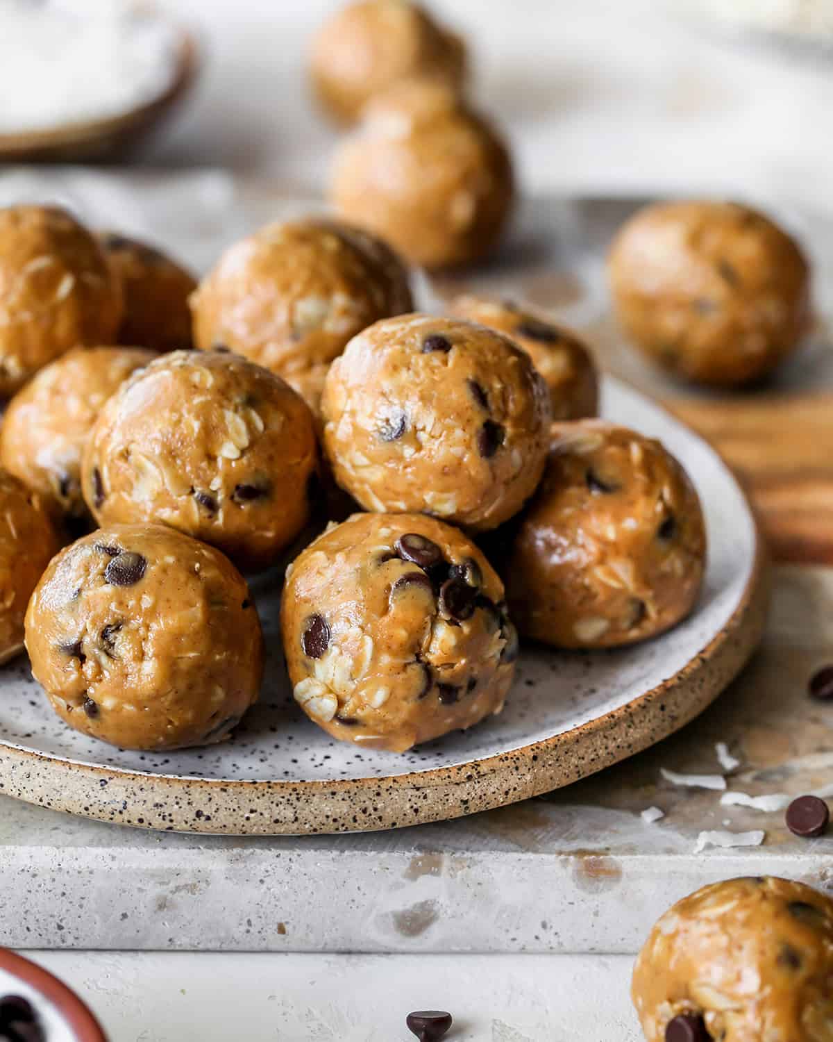 10 Peanut Butter Protein Balls (Energy Balls) stacked on a plate 
