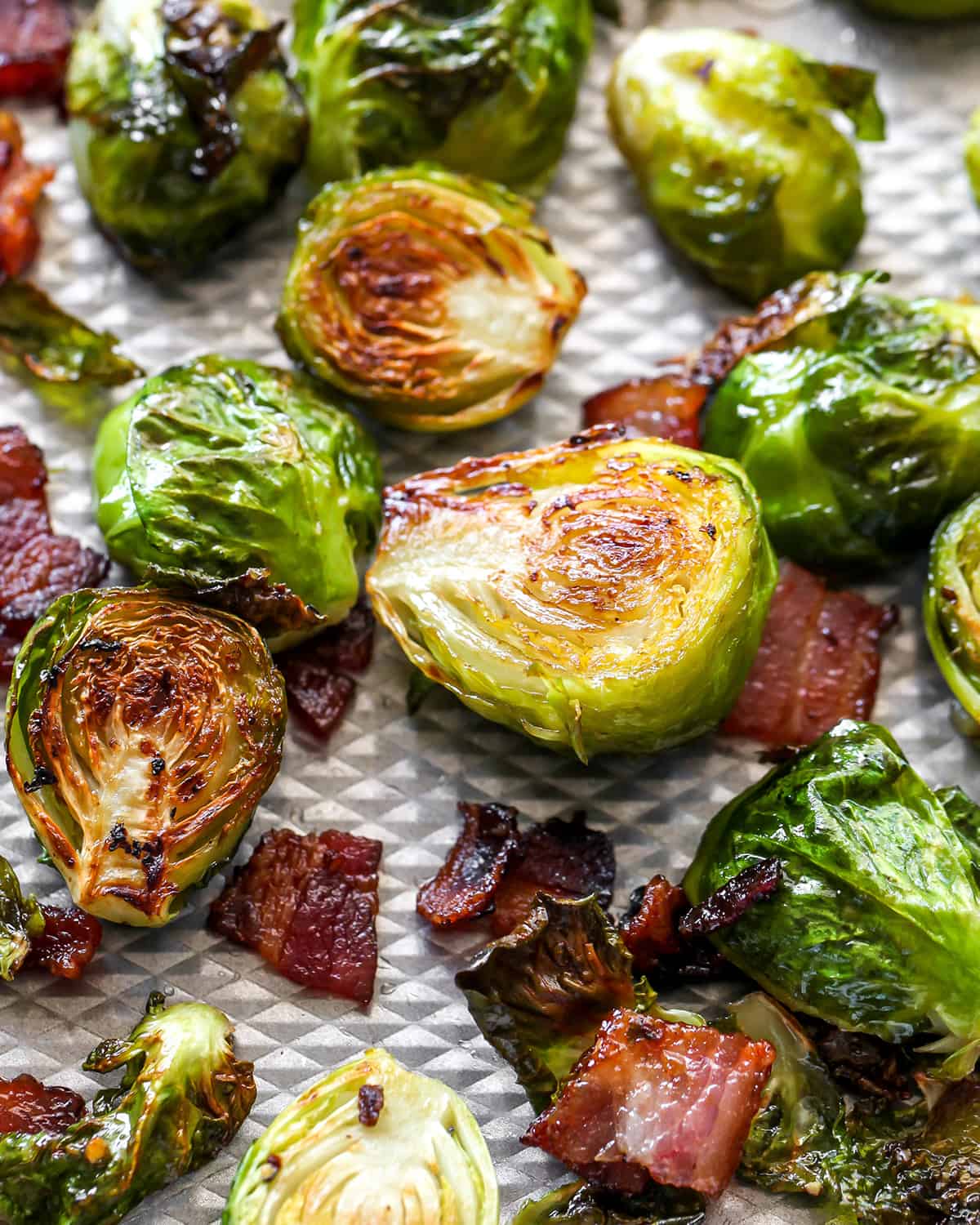 up close view of Brussel Sprouts with Bacon on a baking sheet